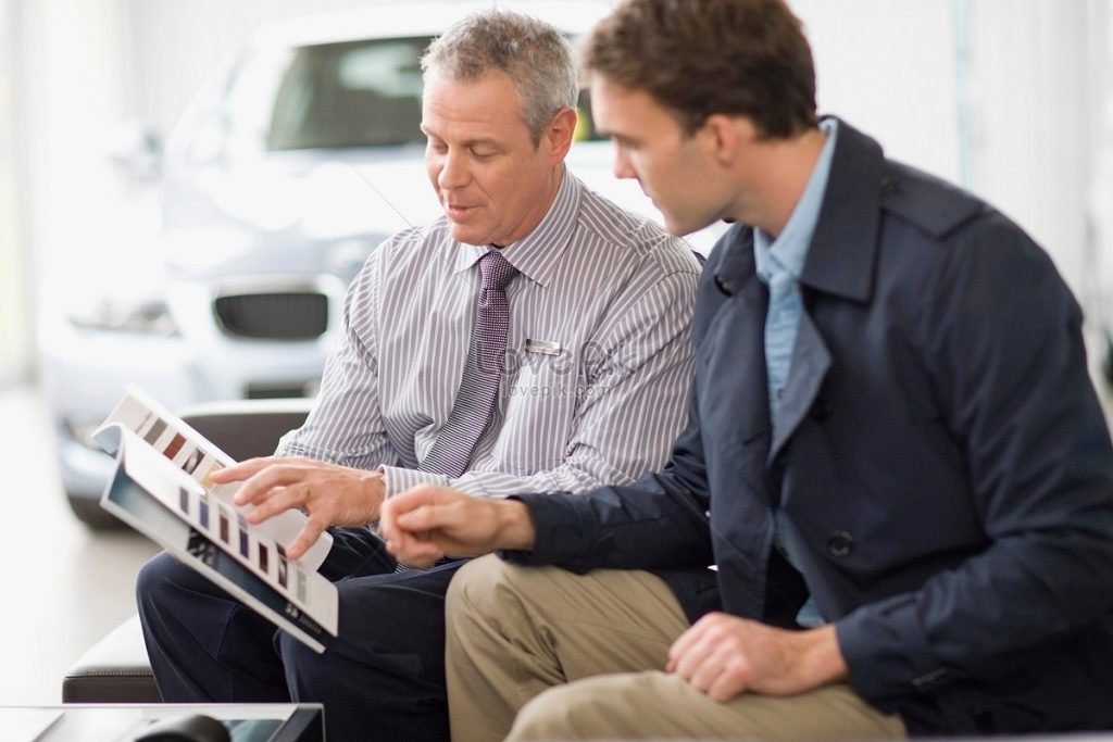 lovepik car salesperson talking with customer picture 501512588